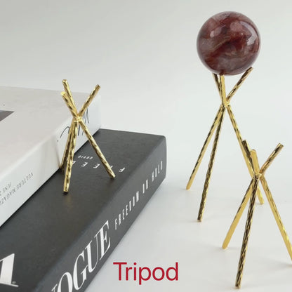 Brilliant golden three-long-leg sphere with pattern crystal base.